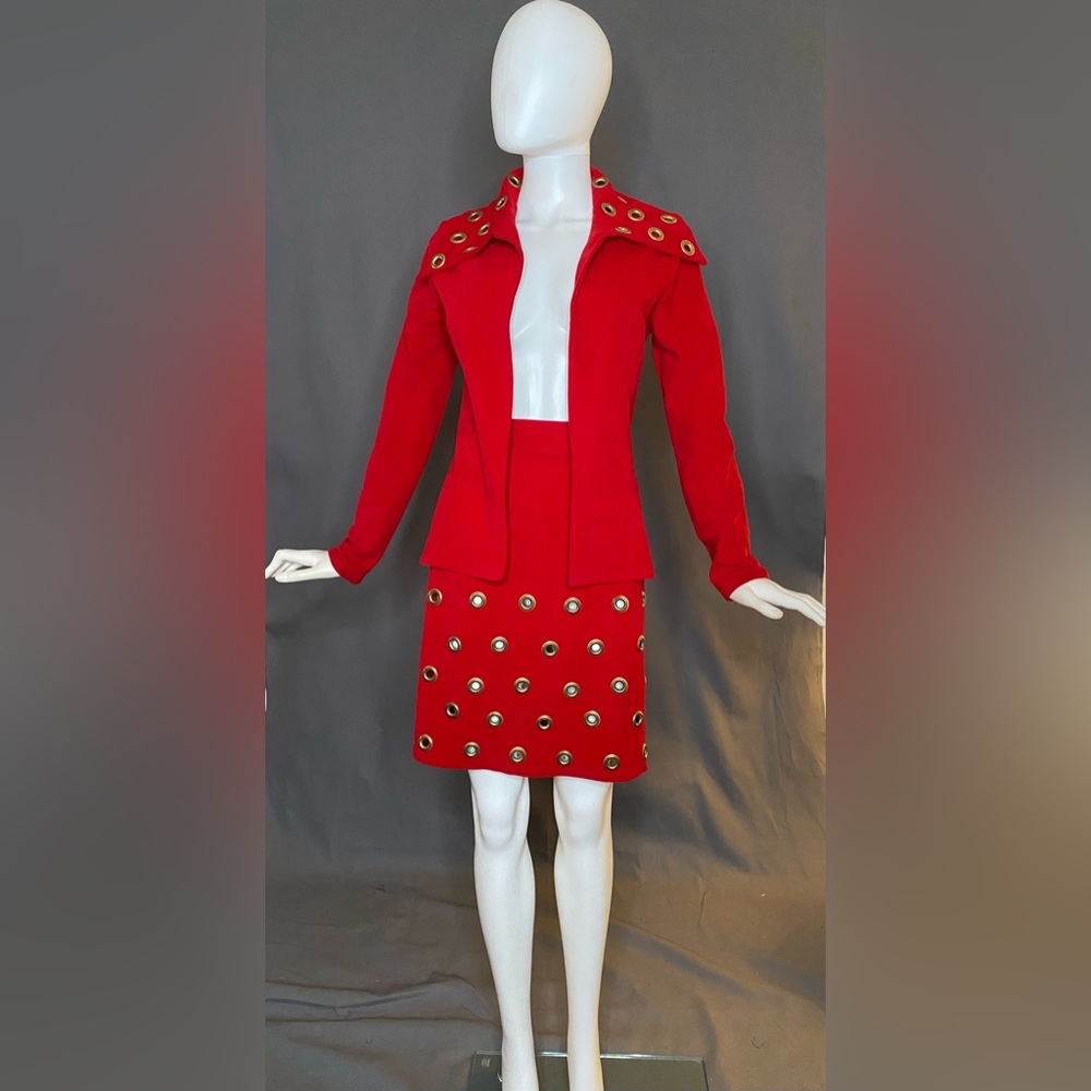 Red microsuede suit with gold grommets (jacket small; skirt: waist 29, hip 38)